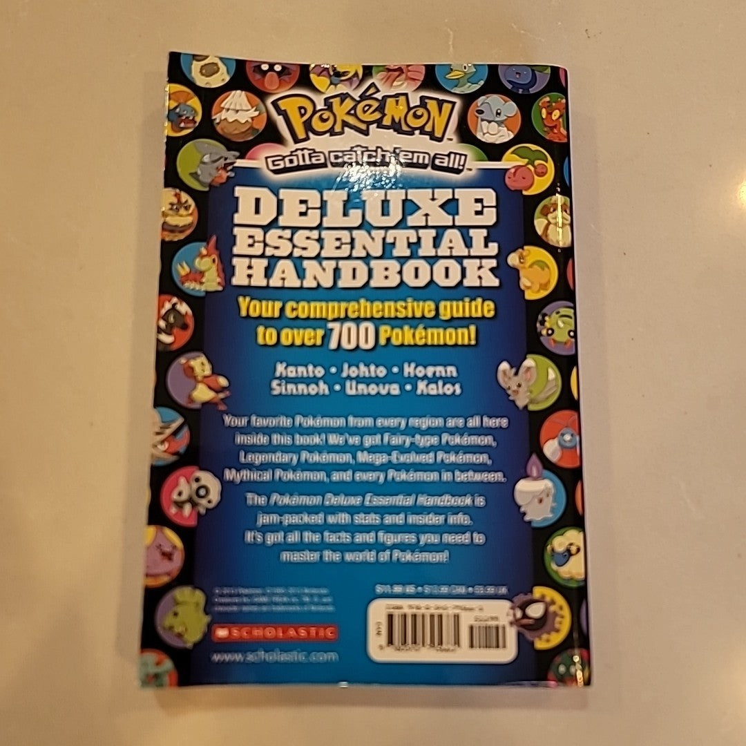 Pokemon Deluxe Essential Handbook: paperback, Scholastic