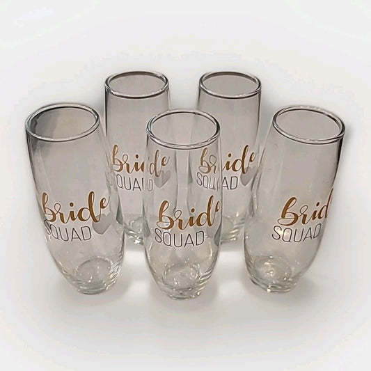 Set of 5 BRIDE SQUAD Champagne flutes. Gold and black letters with white heart